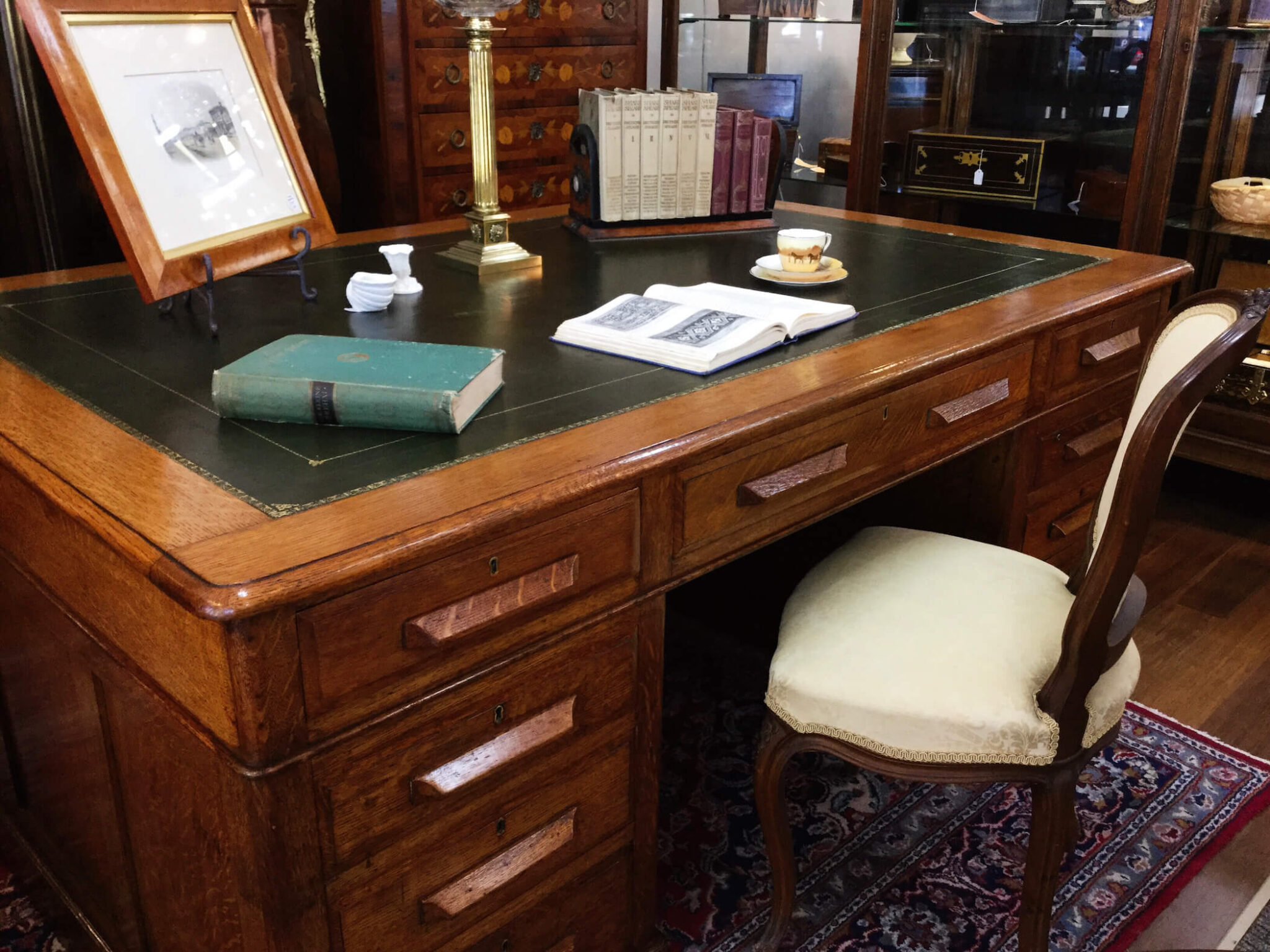 Antique desk and chair with green leather inlay