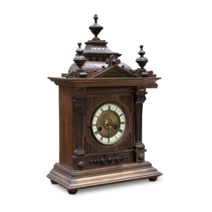 Walnut mantle clock with decorative accents