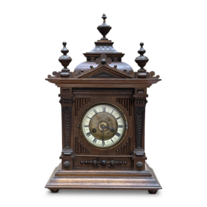 Walnut mantle clock with decorative accents
