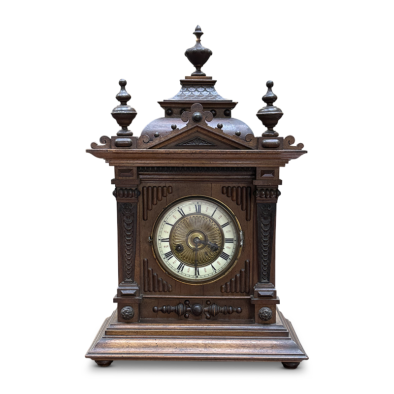 Walnut mantle clock with decorative accents