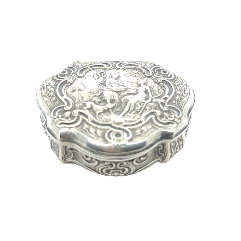sterling silver snuff box c. 1894 with engraved carvings of a man, woman, and dog