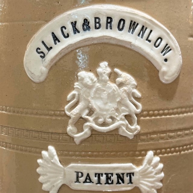 detail of antique stoneware water filter by Slack and Brownlow