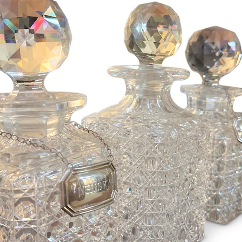 detail on top of crystal sherry decanter and silver labels