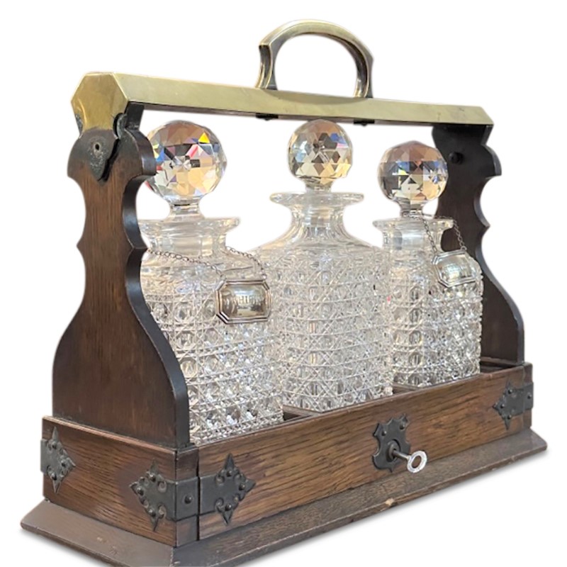 antique crystal whisky decanters set of 3 in an oak tantalus with a brass carry handle and lock