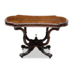 antique burr walnut occasional table with an ornate birdcage base