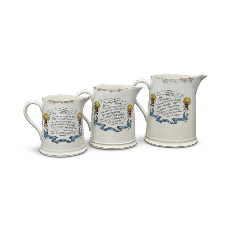 Trio of farmer and verse jugs