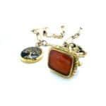 Gold fob chain with seal and pendant