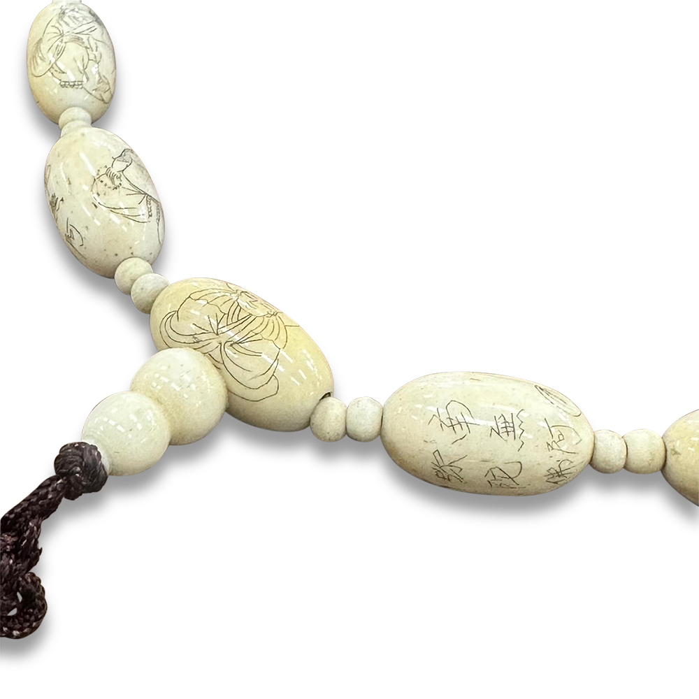 Engraved ivory beaded necklace with tassel