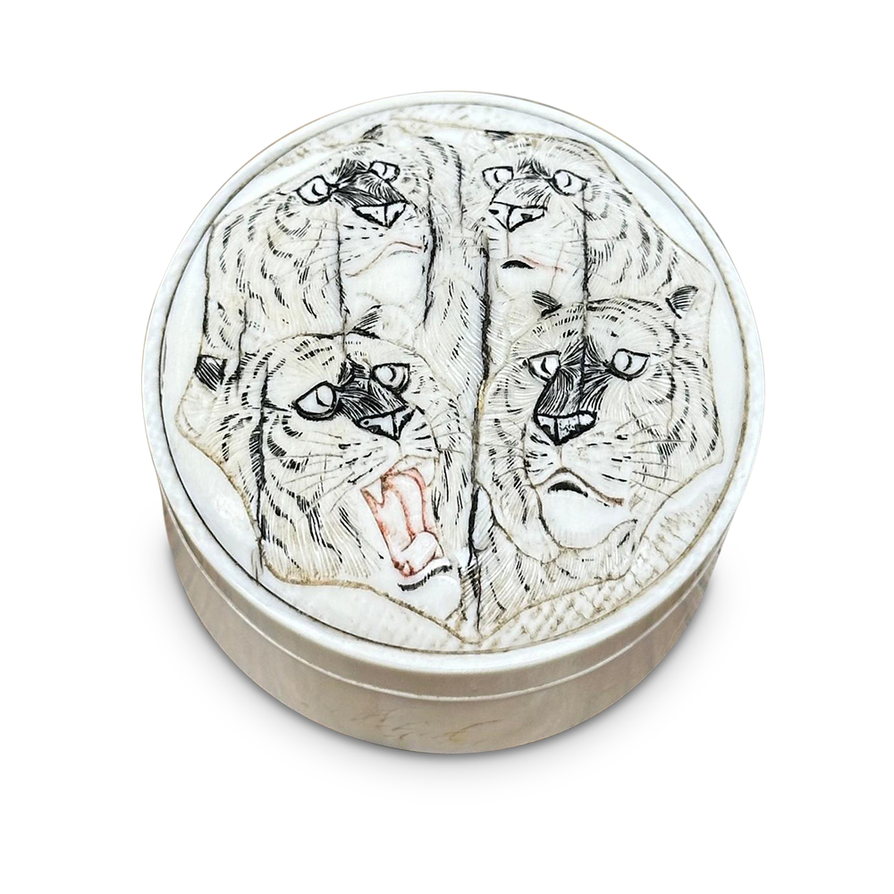 Ivory lidded box with four tigers