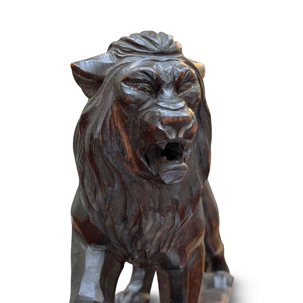 Ebonised carved lion figure c.1910