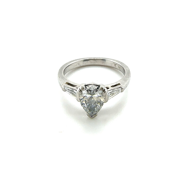 Platinum Pear shaped diamond solitaire ring with diamond baguettes