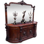 Grand English mahogany 4 door sideboard with ornate carvings and mirrored back c.1860